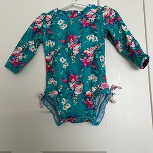 Ruffle Butts rash guard one piece. Only used 2x. Excellent condition no piling!